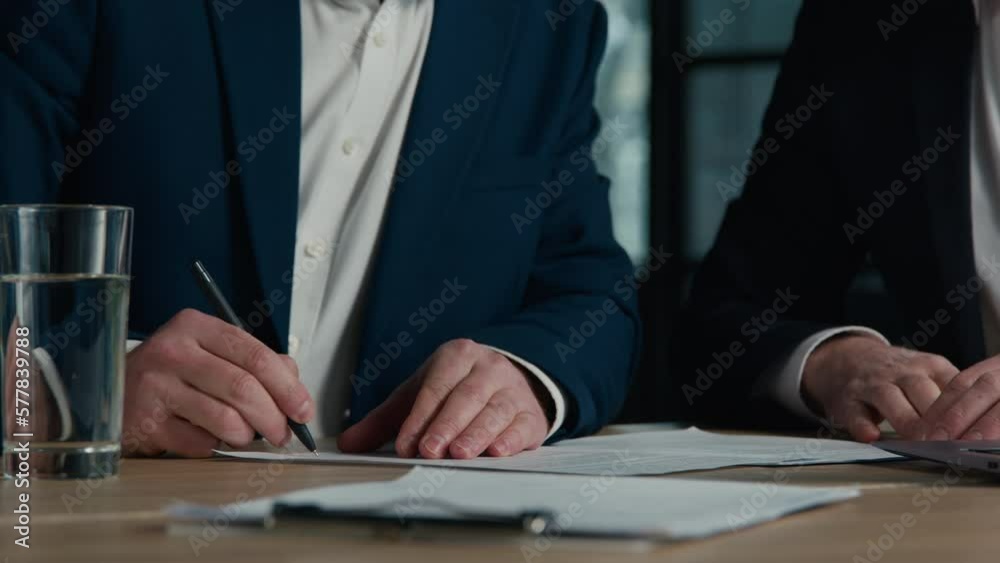 Close-up unrecognizable men businessmen business partners sign contract conclude successful transaction make handshake shake hands congratulations on signing document corporate partnership concept