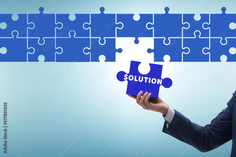 Business solution concept with jigsaw puzzle pieces Business solution concept with jigsaw puzzle pieces