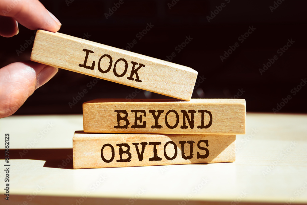 Wooden blocks with words 'Look beyond obvious'. Wooden blocks with words 'Look beyond obvious'.