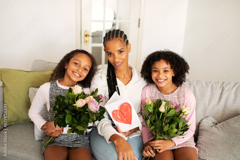 African Mom And Daughters Holding Bouquets Celebrating Holiday At Home