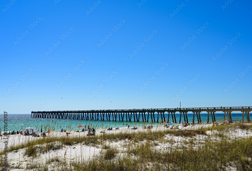 Navarre Beach fishing pier with beach in foreground