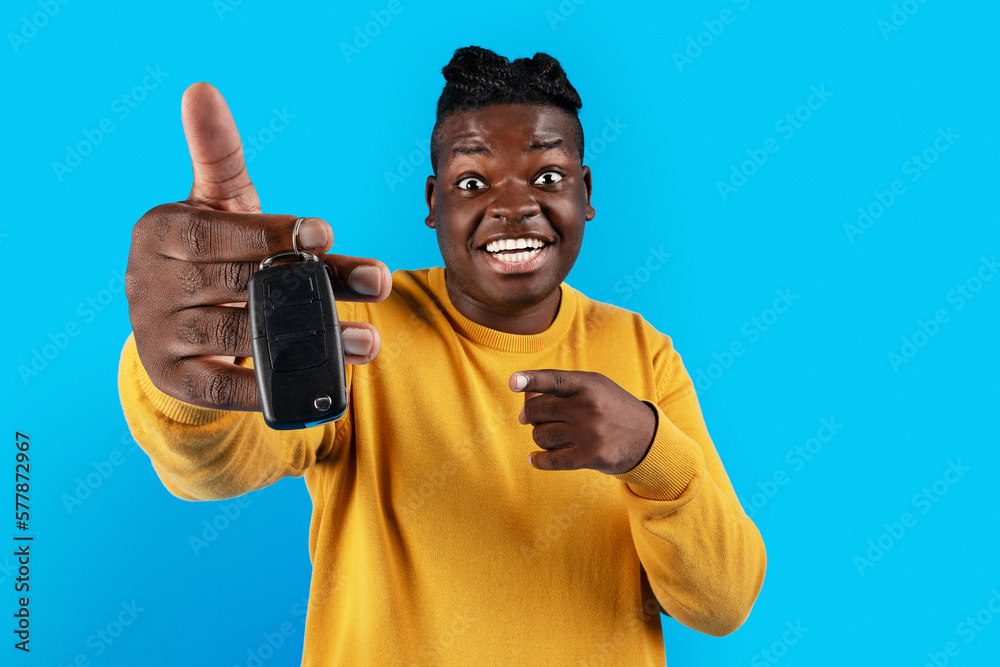 New Vehicle. Excited Black Man Pointing At Car Key In His Hand New Vehicle. Excited Black Man Pointing At Car Key In His Hand