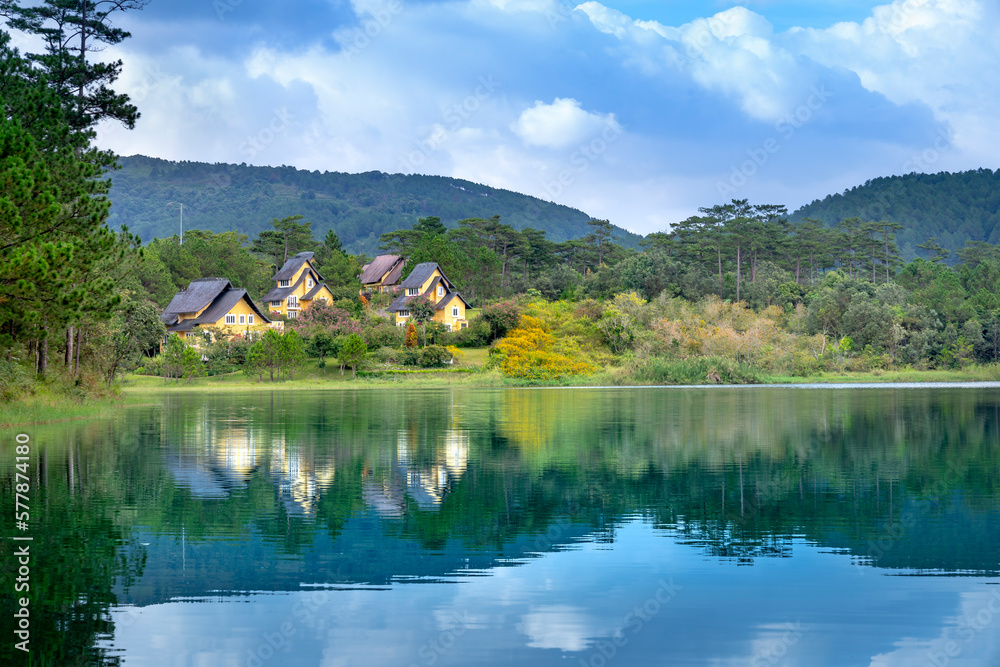 Naklejka premium beautiful pictures of the three villas in Binh An resort reflecting on Tuyen Lam Lake