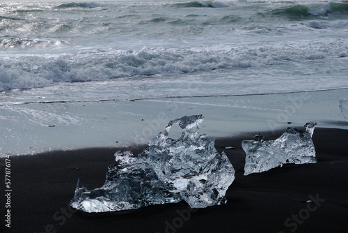 Ice Floes and chunks wash up on pristine black sand beaches on the southern Iceland Coast from melting and calved glaciers