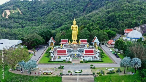 Golden buddha statue on the mountain (Kho Hong) at Hat Yai municipality public park, Songkhla Province, Thailand photo