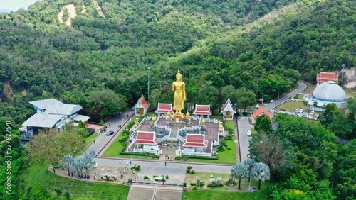 Golden buddha statue on the mountain (Kho Hong) at Hat Yai municipality public park, Songkhla Province, Thailand