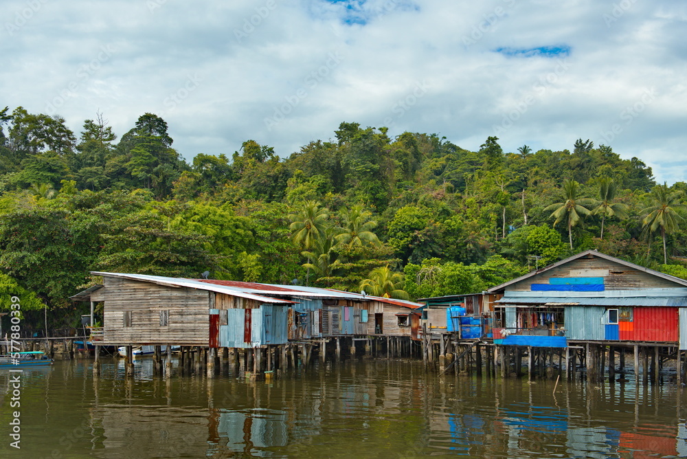 East Malaysia. Sea Gypsy village on a sandy coral reef island. The main trade of local residents is fishing and sea Souvenirs