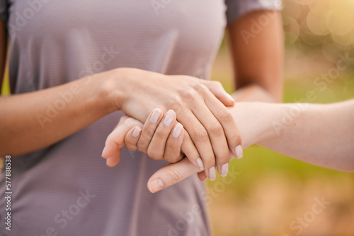 Hands, trust and support with friends outdoor together in a show of unity, solidarity or comfort. Love, empathy and care with a female comforting or consoling a friend outside for compassion © Anela R/peopleimages.com