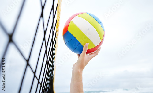 Hands, fitness and beach net volleyball with woman scoring goals in competition, game or match. Sports, training and female athlete holding ball in tournament to score for exercise or workout outdoor