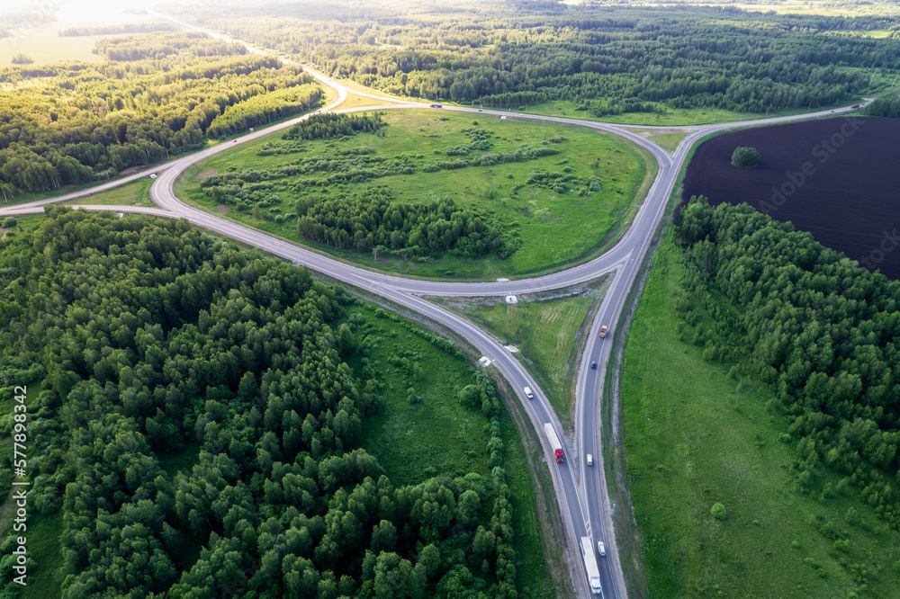 aerial photography of the ring road in summer. car on the road