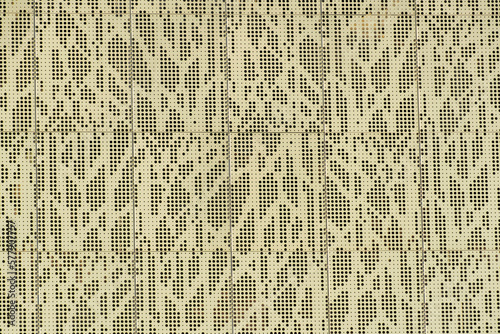 Φωτογραφία Machined metal gate or wall facade with a great many tiny holes and off white ex