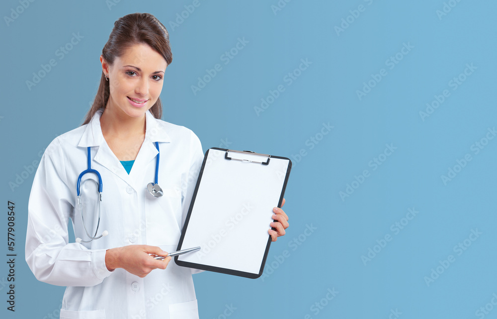 Female doctor holding a clipboard and smiling Female doctor holding a clipboard and smiling