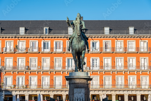 Plaza Mayor of Madrid with its typical buildings and statue of Philip III in the center of the square, Spain.