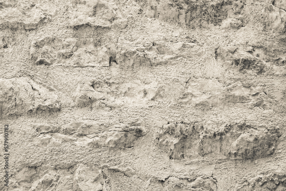 Old castle stone wall texture, close-up. Background from stone masonry for publication, design, poster, calendar, post, screensaver, wallpaper, postcard, banner, cover, website. High quality photo
