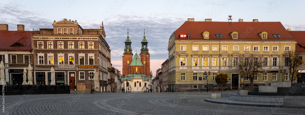 Fototapeta premium Historical road leading towards Gniezno Royal Cathedral on a sunset.
