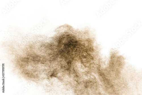 Brown particles splash on white background. Brown dust splatter.