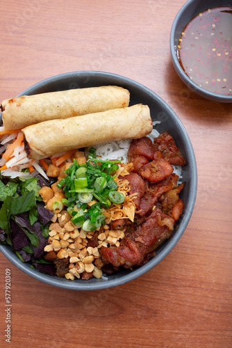 A top down view of a bowl of bun cha gio. photo