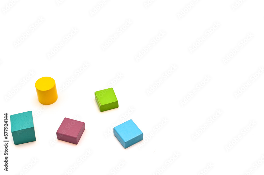 Wooden geometric shapes of different colors. place for text