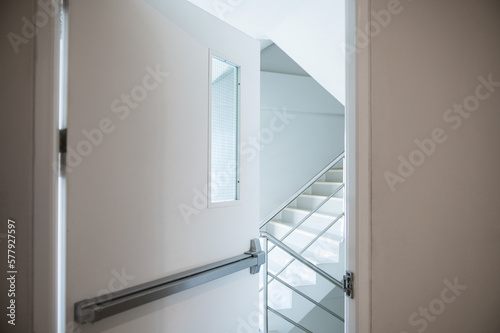 Stairwell fire escape behind the slightly ajar door