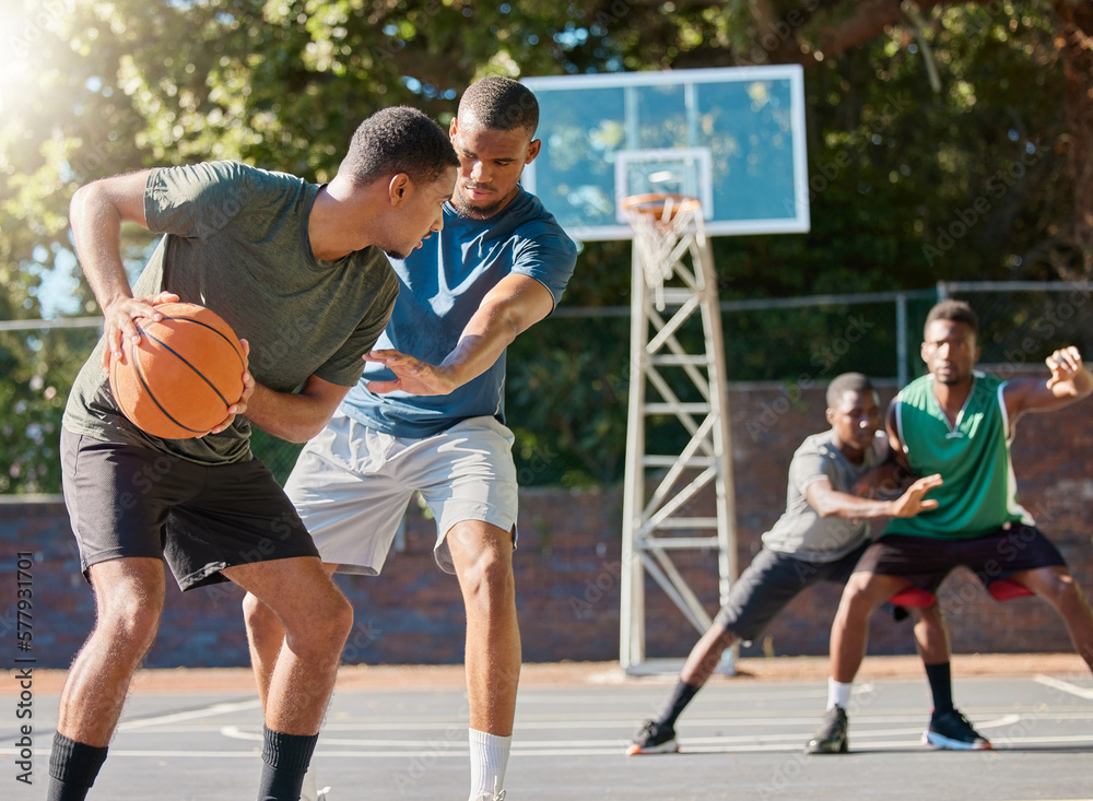 Basketball, sports and competition with a black man athlete playing a game on a court with friends or a rival. Team, fitness and health with a male basketball player training on a basketball court