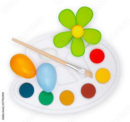 Color palette with paint brushes, flower and colored eggs, top view isolated on a white background. Easter Decorations: Bringing Joy and Cheer to Your Home