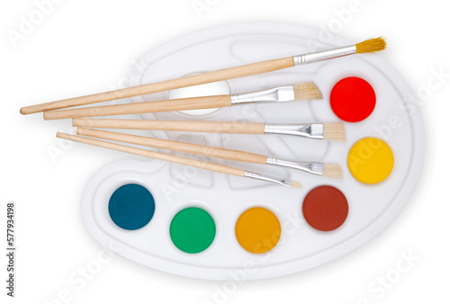 Color palette with paint brushes, top view isolated on a white background, concept of color shop or color choice. Colorful Imagination: An Artist's Palette of Tools and Inspiration.