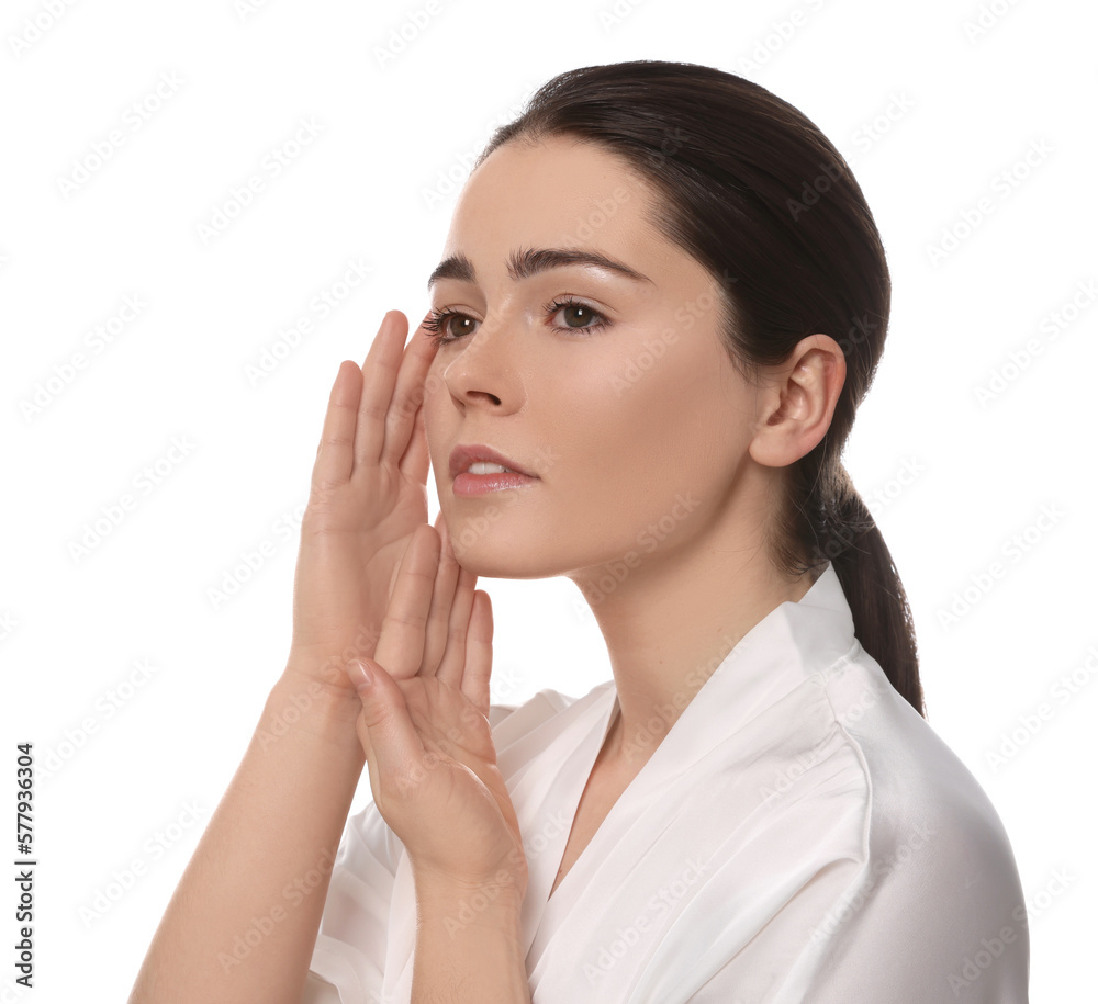 Young woman massaging her face on white background Young woman massaging her face on white background