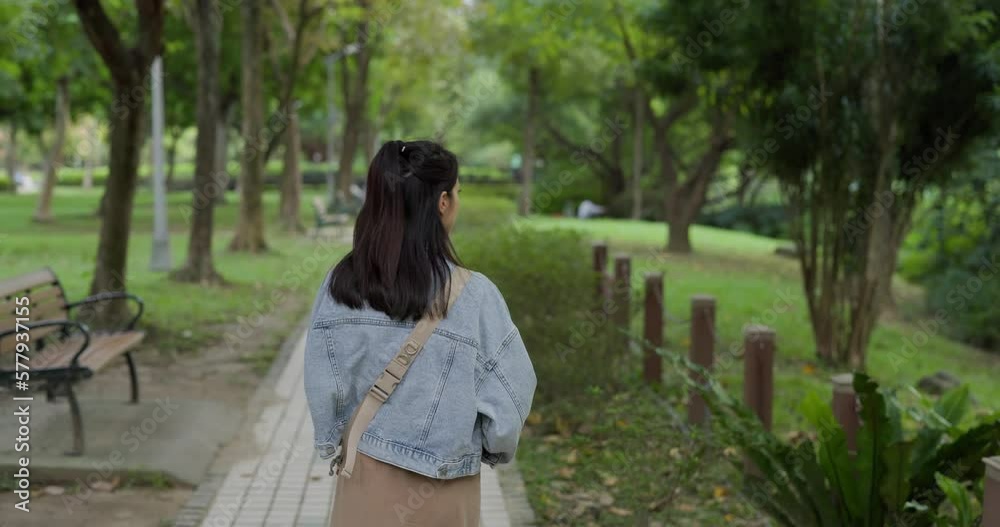 Woman walk in the park garden Woman walk in the park garden