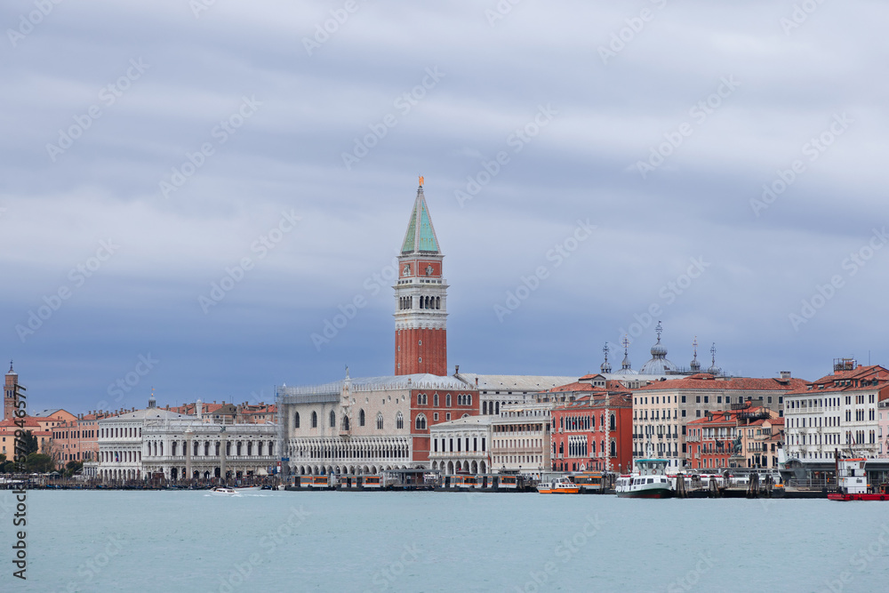 Panoramic overcast view with heavy clouds from the water on Piazza San Marco in Venice city (vertical photo)