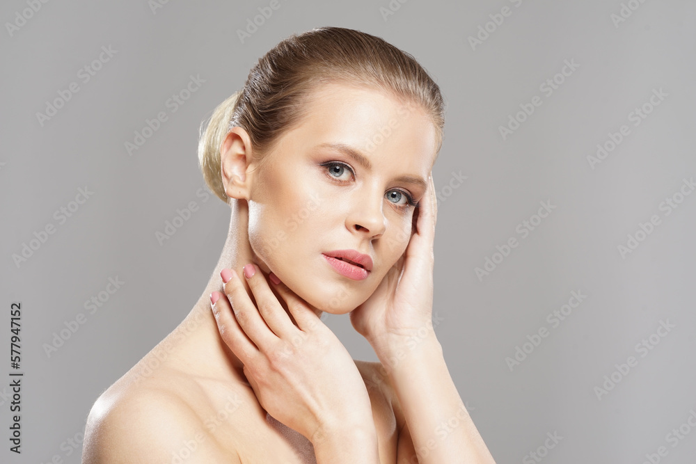 Close-up portrait of beautiful, fresh, healthy and sensual girl over grey background Close-up portrait of beautiful, fresh, healthy and sensual girl over grey background