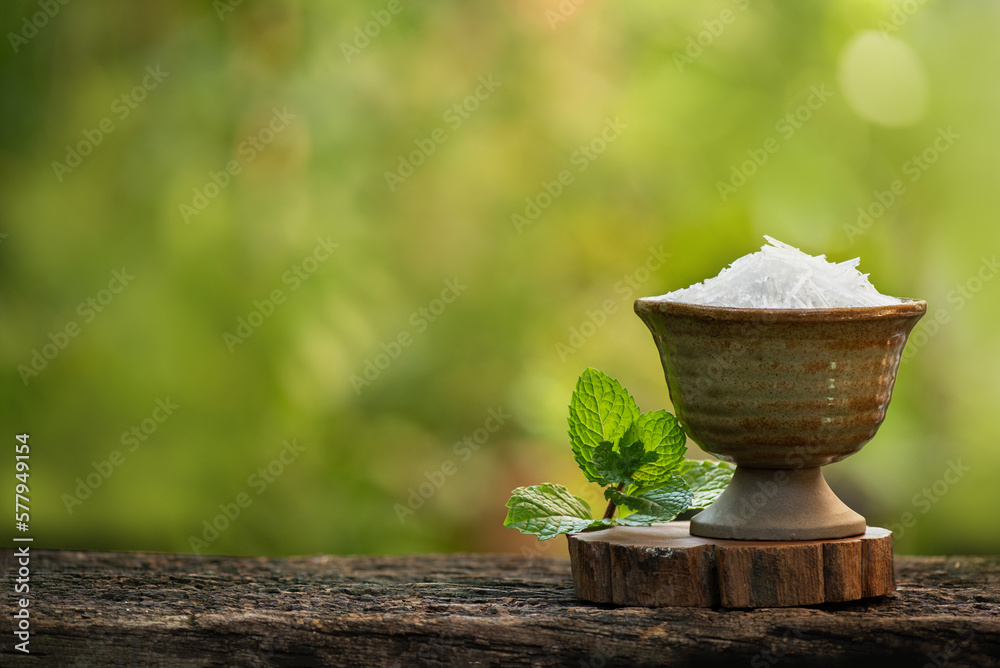 Menthol crystal and peppermint leaves on nature background. Menthol crystal and peppermint leaves on nature background.