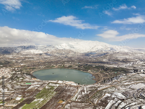 Israel Hermon mountain covered with snow and Ram lake photo