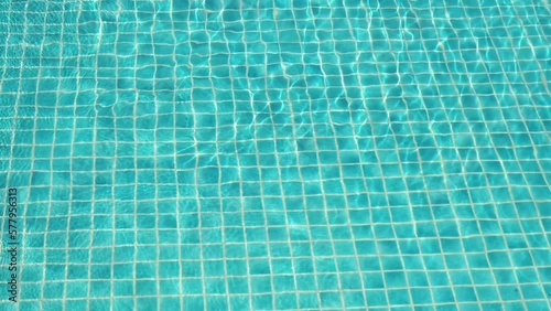 water wave slow motion on blue swimming pool, beautiful pool texture background photo