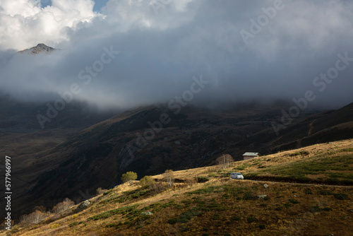 winding road to high mountains and foggy landscape