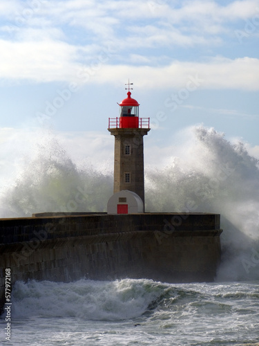 The Felgueiras Lighthouse (Farolim de Felgueiras) embraced by stormy waves Douro river mouth, Porto, Portugal