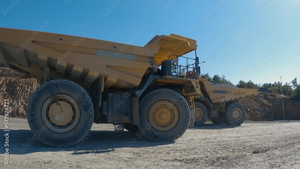 Mining dumper truck mining machinery transport ore from open-pit, slow motion Mining dumper truck mining machinery transport ore from open-pit, slow motion