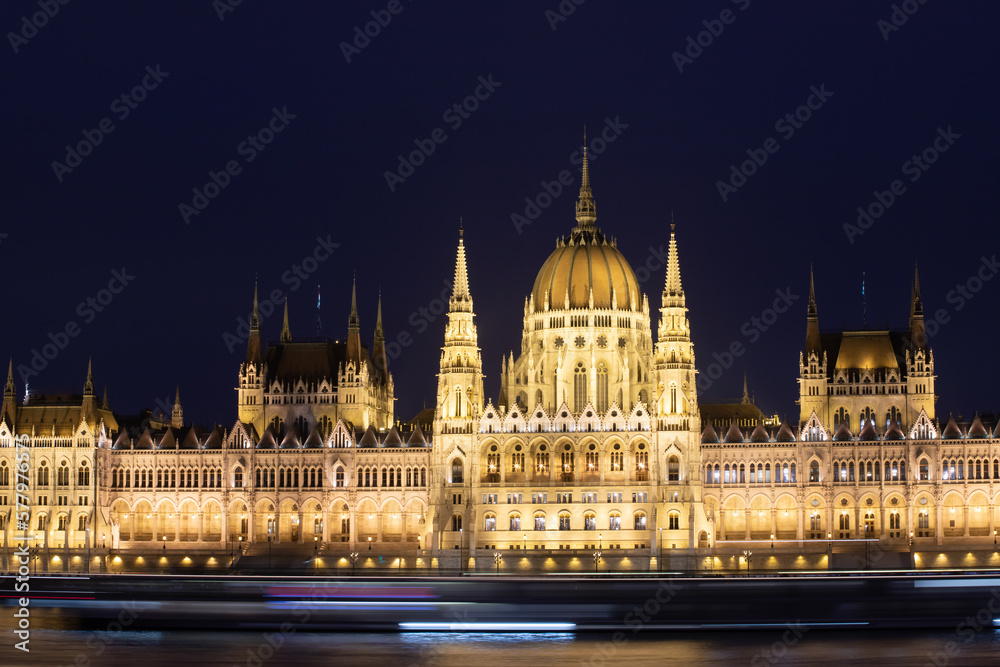 Budapest parliament illuminated at night and Danube river, Hungary