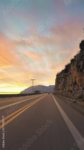 POV car driving, coastline road trip, sunset, vertical short video, wallpaper photo