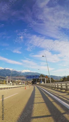 POV road, driving across Peloponnese, Rio Antirrio bridge, road construction, sunny day, vertical short video photo