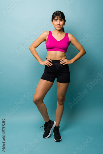 Full length of a fitness woman trainer ready to exercise