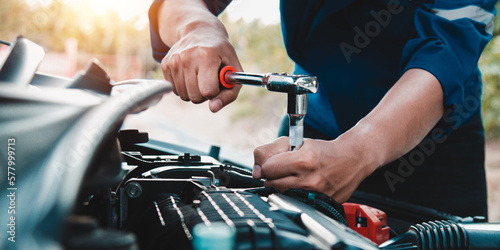 Mechanic open vehicle hood checking up auto mobile, fixing a car at home,Repair and service