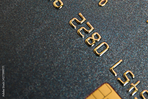Bank card with chip macro on pink background. Modern technologies of payment for goods in the store and online