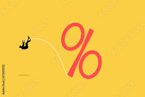 Businessman pole vaulting at percentage sign. concept of money growth concept