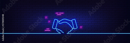 Neon light glow effect. Handshake line icon. Hand gesture sign. Business deal palm symbol. 3d line neon glow icon. Brick wall banner. Handshake outline. Vector