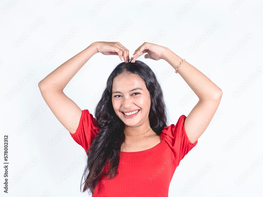 A young woman strikingly posing a A young woman strikingly posing a