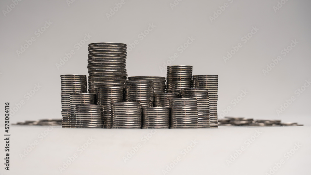 Pile of coins isolated on a white background.