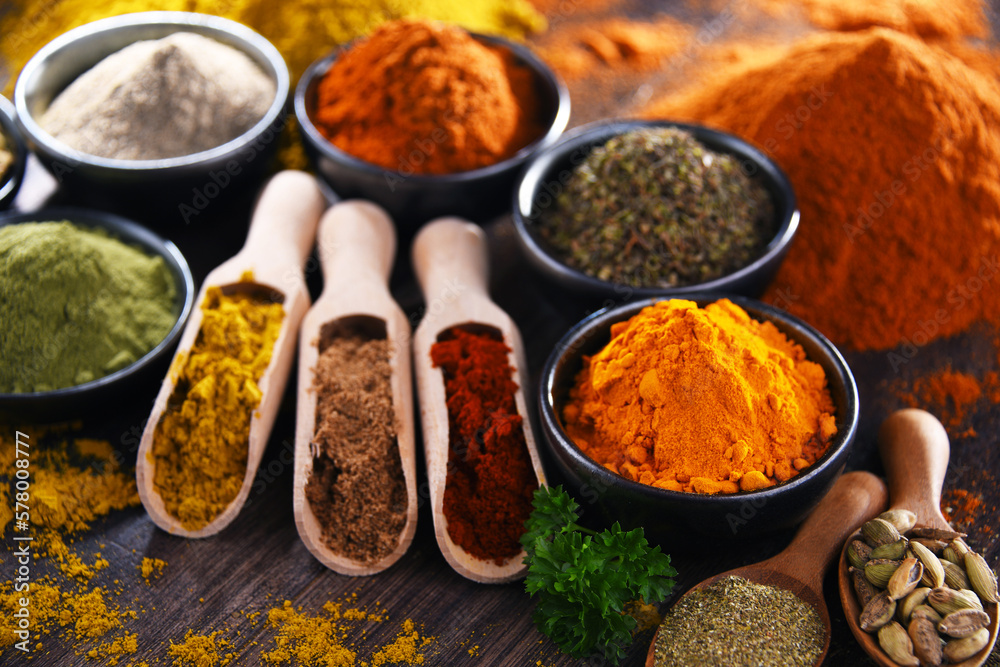 Variety of spices on wooden kitchen table. Variety of spices on wooden kitchen table.