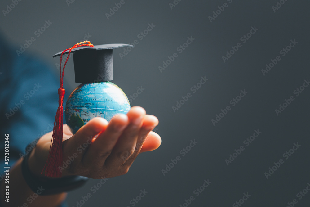Graduation cap with Earth globe. Concept of global business study, abroad educational, Back to School. Education in Global world, Study abroad business in universities in worldwide. language study - obrazy, fototapety, plakaty 