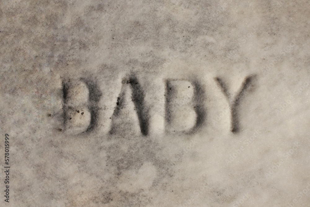 Fototapeta premium Baby written on a vintage tomb.