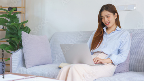 Home office concept, Businesswoman reading data on laptop to analysis marketing plan of startup